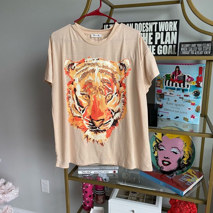 Tiger Print T-Short From Blooming Jelly. Never Worn. Fits Long So Can Fit A Size Medium As Well. Tiger Print Short Sleeve T-shirt For Summer, Short Sleeve Tiger Print T-shirt For Summer, Summer Short Sleeve T-shirt With Tiger Print, Summer Cotton Tops With Tiger Print, Summer Casual Tiger Print T-shirt, Casual Summer T-shirt With Tiger Print, Casual Summer Tiger Print T-shirt, Casual Tiger Print T-shirt For Summer, Casual Tiger Print Short Sleeve T-shirt