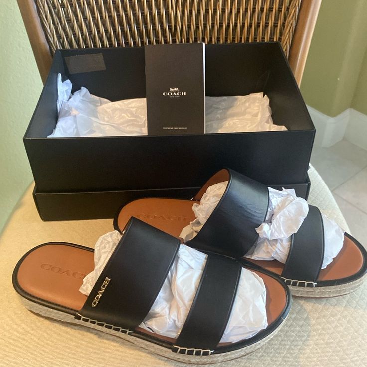 Beautiful Coach Sandals. Brand New In The Box. Women’s Size 9 Style G5131 11002151. They Were Too Big For Me And I Just Didn’t Return . Black Straps With Tan. Coach Card And Box Included Coach Slides With Branded Insole For The Beach, Coach Leather Sandals For Beach, Coach Leather Sandals For Vacation, Coach Slides For The Beach, Coach Slides For Beach, Coach Black Sandals With Cushioned Footbed, Coach Black Sandals For Beach, Coach Sandals With Leather Footbed For Summer, Coach Leather Slip-on Sandals