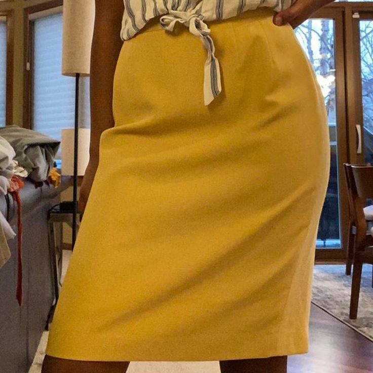 Amazing Vintage Mustard Yellow Pencil Skirt! It’s Knee Length With A Split In The Back. Closes With A Zipper And A Button. Still Looks To Be Brand New. It’s Super Breathable And Comfy. Sized 6p On Model With 26 Inch Waist And 35 Inch Hips For Reference. Please Message Me If You Have Any Questions. Retro Fitted Bottoms For Office, Retro Mini Skirt For Spring Workwear, Retro High Waist Skirt For Work, Casual Yellow Bottoms For Office, Retro Skirt For Workwear, Fitted Yellow Pencil Skirt For Spring, Retro Skirt For Work, Fitted Yellow Bottoms For Office, Retro Pencil Skirt For Workwear