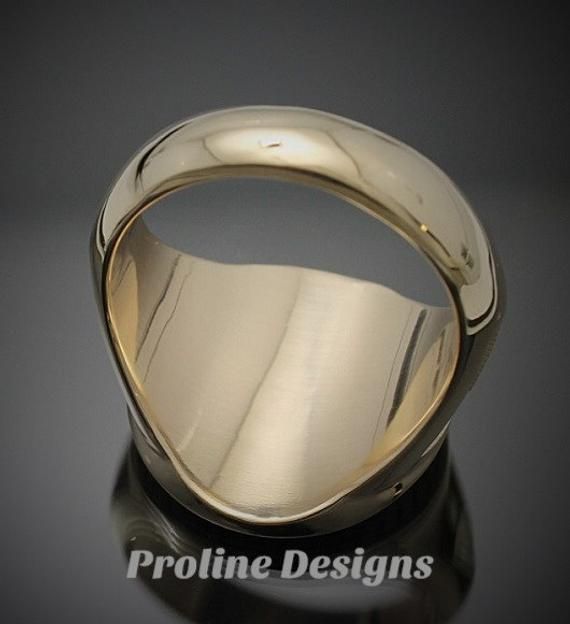 Made entirely in the U.S.A. Ring Details~ Bold - Handsome - Exquisitely Finished - Original The newest addition to our Prestige Collection, this gold version of our moral compass ring is sure to stand out. The top prominently features the square and compass with the four directions around the outer edge. The side windows display the symbolic trowel and level on a textured background. Hand finished to perfection, the high polish creates a contrast against the sandblasted background. All creations Collectible Yellow Gold Rings With Polished Finish, Collectible Polished Yellow Gold Rings, Timeless Gold Engraved Ring, 14k Gold Timeless Signet Ring For Collectible, 14k Gold Timeless Signet Ring Collectible, Timeless 14k Gold Signet Ring For Collectors, Modern Yellow Gold Collectible Rings, 14k Gold Signet Ring With Polished Finish, Heirloom Dome Ring With Polished Finish