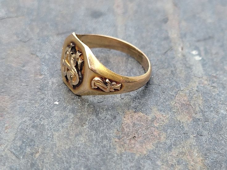 Antique Victorian 1924 Class Ring.  This unique lady weighs 4.2g and is a size 6 3/4.  She measures 12mm front center, north to south.  I think she looks great for her age right at 100 years old!  She is hallmarked 10k along with the makers mark Elliott Co. Please note all items are in previously loved, used condition so please review all photos closely and let me know if you have any questions prior to purchasing. I'm not a jeweler or gemologist & I pass on all information available to me. As a 1976 Class Ring, Victorian Signet Ring With Maker's Mark, Victorian Signet Ring With Maker's Mark As Gift, Vintage Engraved Ring With Antique Finish For Anniversary, Victorian Brass Rings For Anniversary, Heirloom Style Gold Ring With Antique Finish, Heirloom Style Antique Finish Rings For Anniversary, Heirloom Gold Ring With Antique Finish, Antique Finish Rings For Anniversary