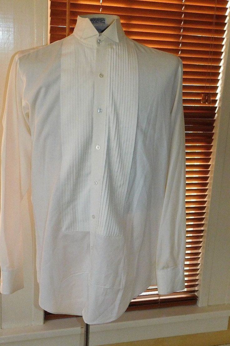 Label: Georgio Patrino Likely 90's or newer cotton/poly formal shirt with wing tip collar and small wale bib - shirt has convertible bib buttons and cuffs (you can use cufflinks and shirts studs or just use the buttons) Size    Neck: 15 / Chest: 42-44 / Sleeve: 24" / Across Shoulder Seams: 17" Condition:  Excellent  AMERICAN VINTAGE CLASSICS RST044 Spring Formal Button-up Shirt, Business Tuxedo Shirt With Long Sleeves, Fitted Tuxedo Shirt For Formal Occasions, Formal Fitted Tuxedo Shirt, Formal Tuxedo Dress Shirt With Long Sleeves, Formal Button-up Dress Shirt For Summer, Fitted Collar Shirt For Formal Occasions, Formal White Buttoned Top, Formal Tops With Covered Buttons And Collar