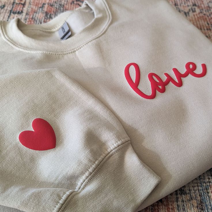 Looking for a retro puff valentines day sweatshirt? Look no further than our selection of women's love sweatshirts!  Whether you're looking for a cozy sweater to keep you warm on chilly days or a fashionable valentines gift for your loved one, our love collection has everything you need. So why wait? Add a women's valentines day sweater to your shopping list today!     SIZING    * UNISEX sizing  * Please check the size chart in the listing photos for measurements. Size down for a tighter fit Normal size for loose comfy fit Size up for oversized.     HOW TO ORDER    1. Select your style, size and color from the drop down menus 2. Add your personalized name (optional) 4. Click ADD TO BASKET. You can then go back to add more sizes or colors. 5. Proceed to Checkout     CARE INSTRUCTIONS    * W Cute Valentine's Day Crew Neck Sweatshirt, Cute Crew Neck Sweatshirt For Valentine's Day, Valentine's Day Cotton Sweatshirt Gift, Valentine's Day Gift Cotton Sweatshirt, Casual Heart Graphic Sweatshirt Gift, Valentine's Day Cotton Sweatshirt With Heart Graphic, Trendy Valentine's Day Crew Neck Sweatshirt, Valentine's Day Sweatshirt With Relaxed Fit And Crew Neck, Valentine's Day Crew Neck Sweatshirt With Relaxed Fit