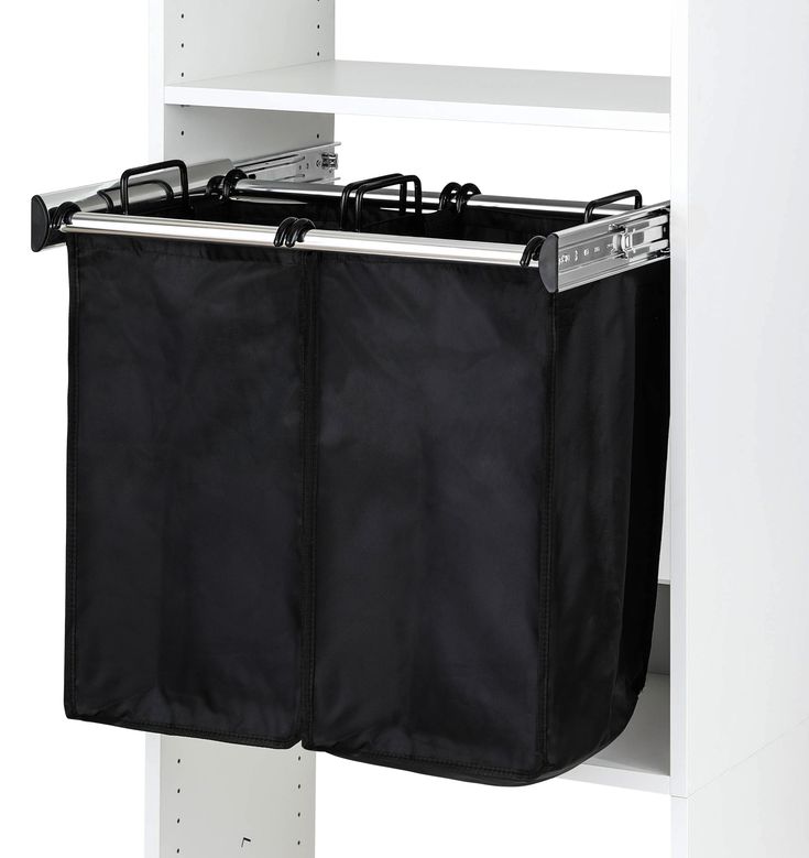 a black bag hanging from the side of a white shelf