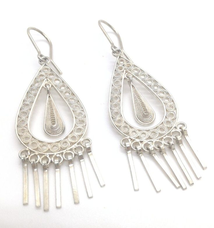 Brand New Silver Drop Earings.  Hand Crafted to its finest detail. 925 Fine Silver Filigree. We specialize on Fine Filigree Art Jewelry. Any questions please feel free to contact me. Artisan Jewelry Earrings, Filigree Jewelry, Handcrafted Artisan Jewelry, Silver Filigree, Art Jewelry, Fine Silver, Artisan Jewelry, Jewelry Art, Jewelry Watches