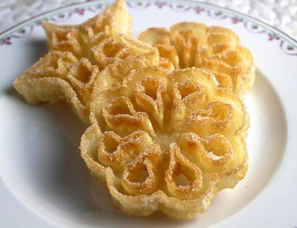 two pieces of pastry sitting on top of a white plate