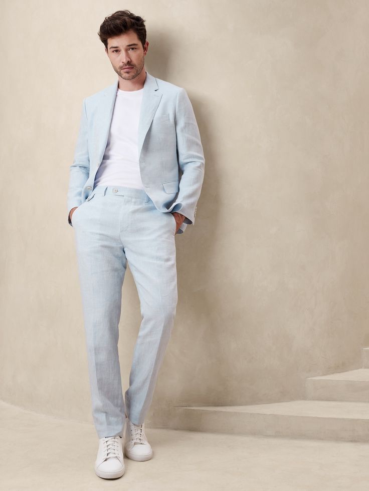 This European linen suit pant traverses all seasons thanks to its natural breathability and beautiful finish—seen here in a rich délavé blue.  Tailored Slim Fit: Mid-rise.  Tapered slim leg.  Zip fly with button-tab waistband.  Belt loops and after-dinner split detail at back.  Front and back pockets.  Half lined (lined to the knee).  Tailored Slim Fit: Mid-rise.  Tapered slim leg.  Inseams: Short 29. 5", Regular 31. 5", Long 33. 5" Model: Size 32 Regular, 6'2" (188cm). Light Wash Straight Hem Spring Pants, Light Wash Pants With Straight Hem For Spring, Spring Light Wash Pants With Straight Hem, Spring Light Wash Straight Hem Pants, Classic Light Wash Pants For Spring, Fitted Straight Leg Washed Blue Pants, Tailored Straight Leg Spring Suits, Spring Tailored Suits With Tapered Leg, Spring Suits Tailored With Tapered Leg