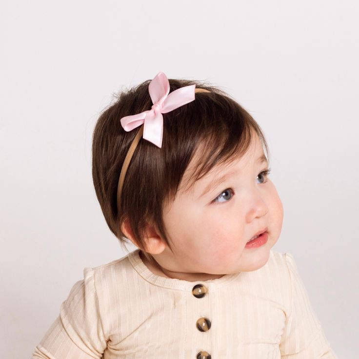 Dress your little one up with our satin bows! Handmade by local moms from high-quality satin. This is the perfect bow for your darling little girl! Each bow is hand tied and is attached to a nylon headband. All bows are secured so they do not come undone! Size:Small - 2.5 in x 1.5 inLarge - 3.5 in x 2 in Perfect Bow, Pink Headband, Pink Headbands, Come Undone, Newborn Essentials, Small Bows, Happy Mom, Large Bow, Satin Bow