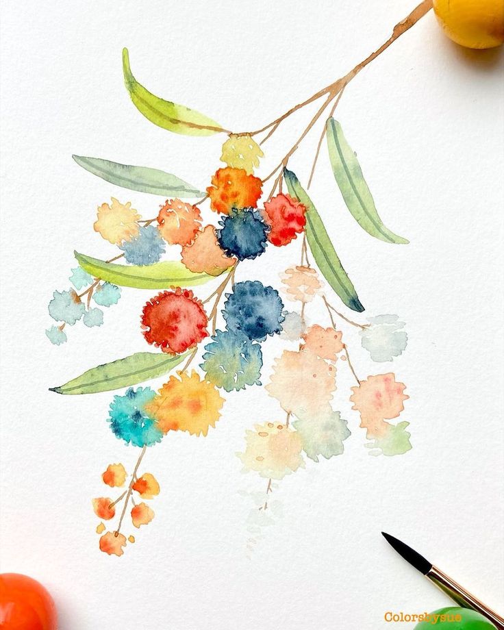 a watercolor painting of flowers and leaves on a white paper with colored pencils