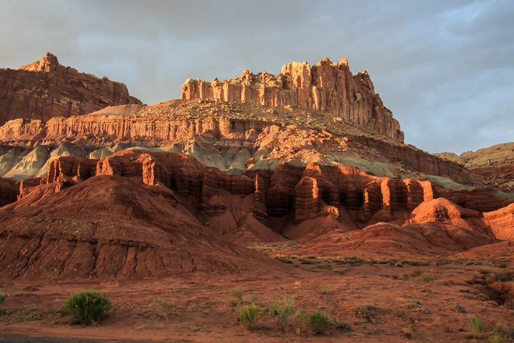 the mountains are red and brown in color