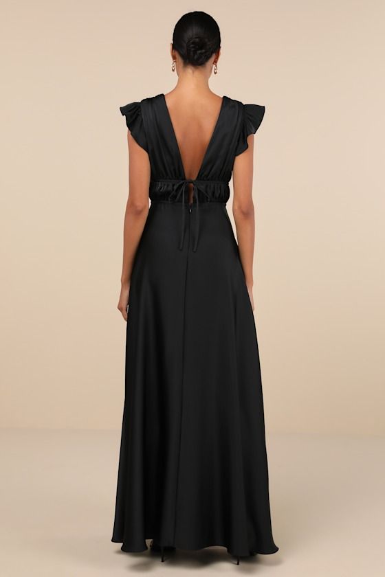 The Lulus I'm All Yours Black Satin Cutout Ruffled Maxi Dress is dedicated to making you look lovely! Sleek woven satin sweeps from ruffled, cap sleeves into a plunging V-neckline and matching V-back. A banded empire waist, with a set of tying details at the front and back, sits atop a cascading skirt that falls to an elegant maxi hem. Hidden back zipper/clasp. Fit: This garment fits true to size. Length: Floor length. Size medium measures 48.5" from shoulder to hem. Bust: Great for any cup size Wedding With Black Bridesmaid Dresses, Resort Formal, Satin Black Dress, Short Sleeve Bridesmaid Dress, Black Prom Dress Short, Formal Wedding Attire, Winter Formal Dresses, Maxi Skirt Dress, Black Satin Dress