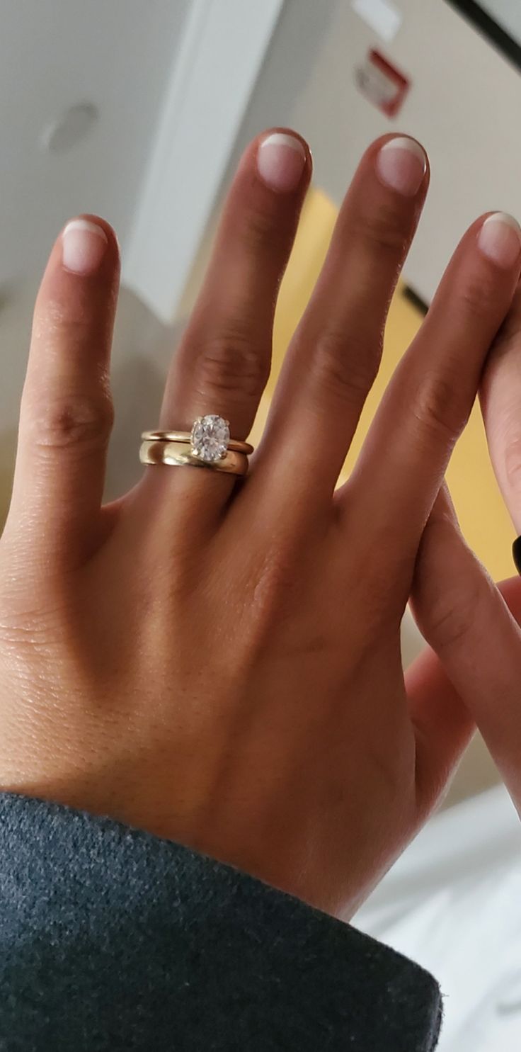 a woman's hand with a ring on it