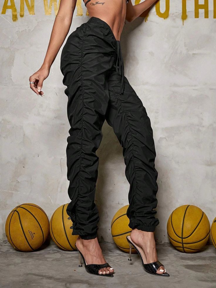 Explore the great outdoors or go for a casual event in style with these Drawstring Cargo Jogger Pants! Crafted from lightweight fabric and featuring a classic drawstring waist in a bold and elegant black color, they offer the utmost comfort and a perfect fit. So whether you’re strolling in the park or tackling a trail, do it in style. Details: Color: Black Style: Casual Pattern Type: Plain Type: Jogger Closure Type: Drawstring Waist Waist Line: High Waist Length: Long Fit Type: Regular Fit Fabri Black Drawstring Cargo Pants For Spring, Spring Black Cargo Pants With Drawstring, Summer Nylon Drawstring Pants, Black Nylon Drawstring Bottoms, Black Stretch Bottoms With Functional Drawstring, Black Nylon Bottoms With Drawstring, Black Stretch Parachute Pants With Drawstring, Spring Sweatpants With Drawstring, Black Drawstring Bottoms For Fall