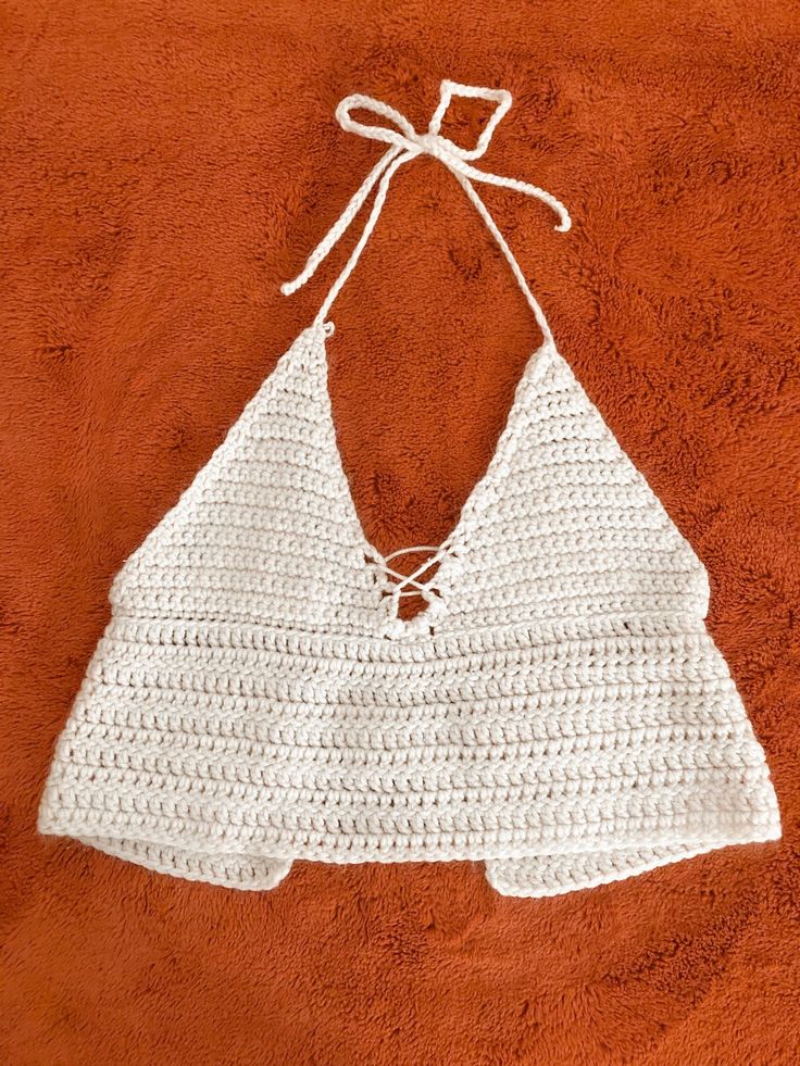 This product was hand crocheted made entirely from recycled materials.  Easily adjusts to fit multiple sizes.  An eco-friendly cute summer tank that can go with any outfit! Crochet Sleeveless Tank Top For Beach Season, Sleeveless Crochet Tank Top For Beach Season, Summer Beach Crochet Cami Top, Crochet Sleeveless Tank Top For Vacation, Knit Crochet Top For Summer, Crochet Tank Top For Beach Vacation, Crochet Tank Top For Summer Vacation, Summer Beach Knit Tank Top, White Knitted Sleeveless Crop Top