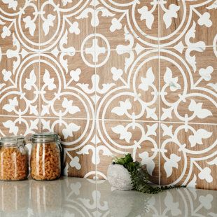 jars filled with food sitting on top of a counter next to a tile backsplash