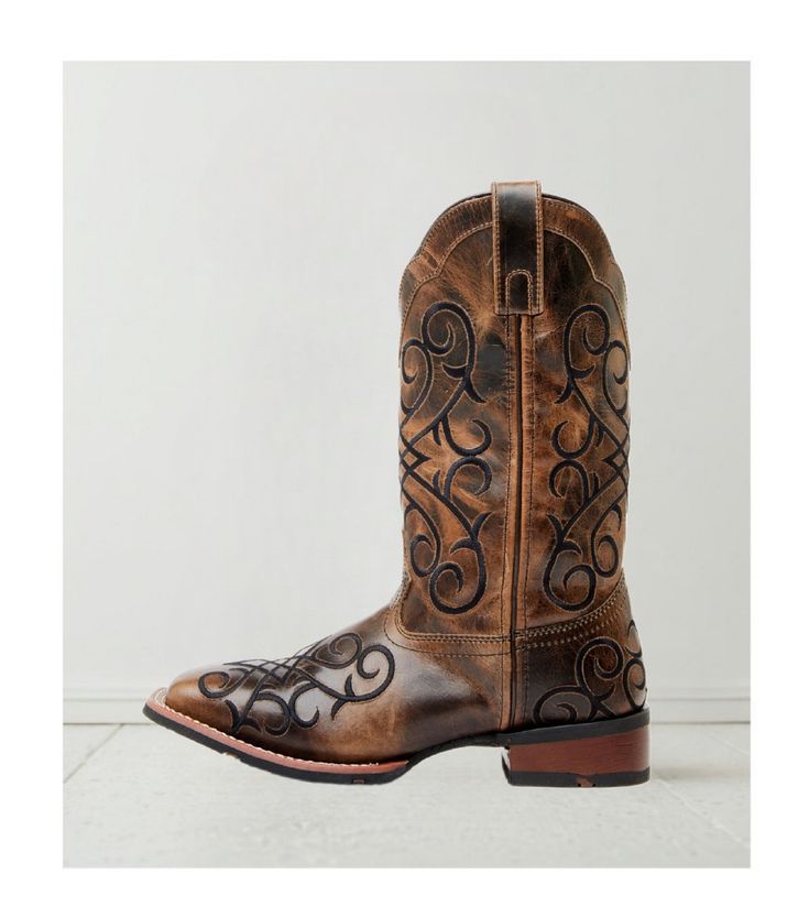 Step into elegance and comfort with the Women's Margo Western Boots. Featuring a broad square toe design, these boots are the perfect combination of rustic charm and contemporary style, making them a must-have for any cowgirl's wardrobe. Constructed with a durable leather upper, the Margo boots promise both quality and longevity. The rubber outsole ensures reliable traction, making them suitable for a variety of terrains. The pull-on style with handy pull tabs allows for easy wearing, providing Rustic Square Toe Boots For Rodeo, Rustic Square Toe Ranch Boots, Western Wide Calf Heeled Boots With Square Toe, Rustic Brown Boots With Square Toe, Western Mid-calf Boots With Square Toe And Reinforced Heel, Rustic Brown Square Toe Boots, Country Style Fitted Boots With Square Toe, Country Style Fitted Square Toe Boots, Country Style Boots With Square Toe For Western-themed Events