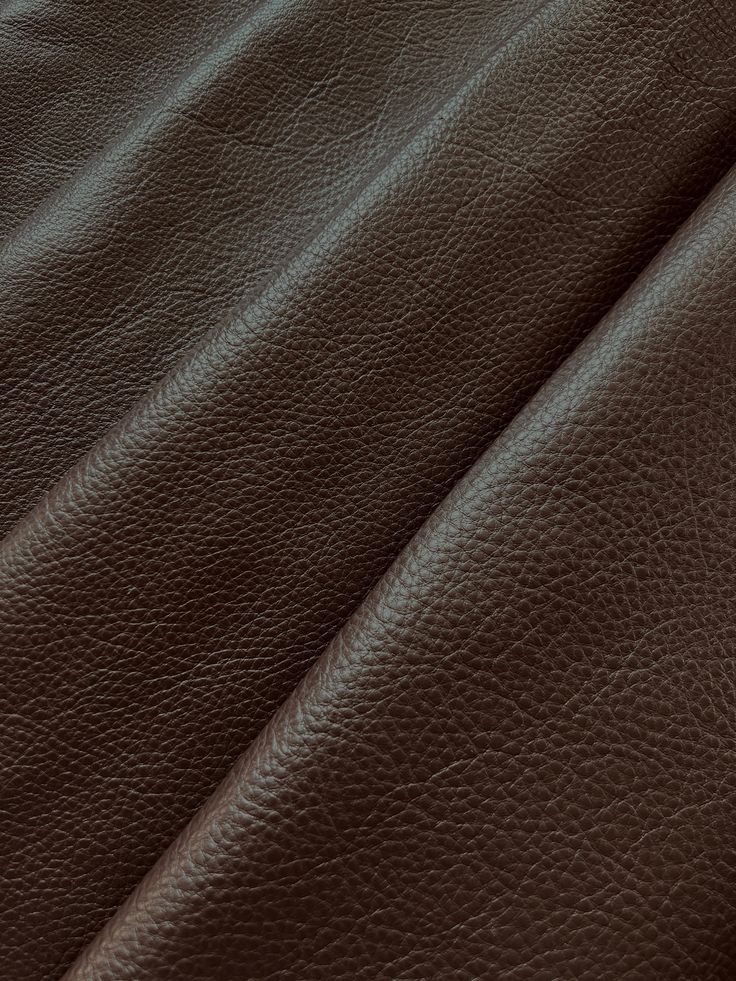 brown leather textured up close to the surface