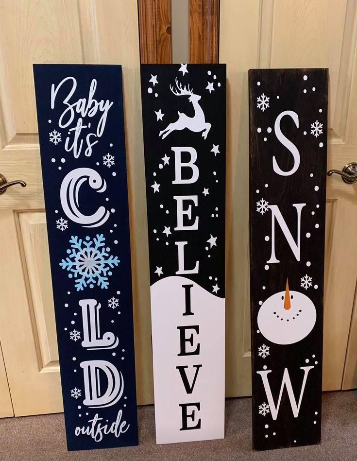 three wooden signs that say baby it's cold outside, snow and sleigh