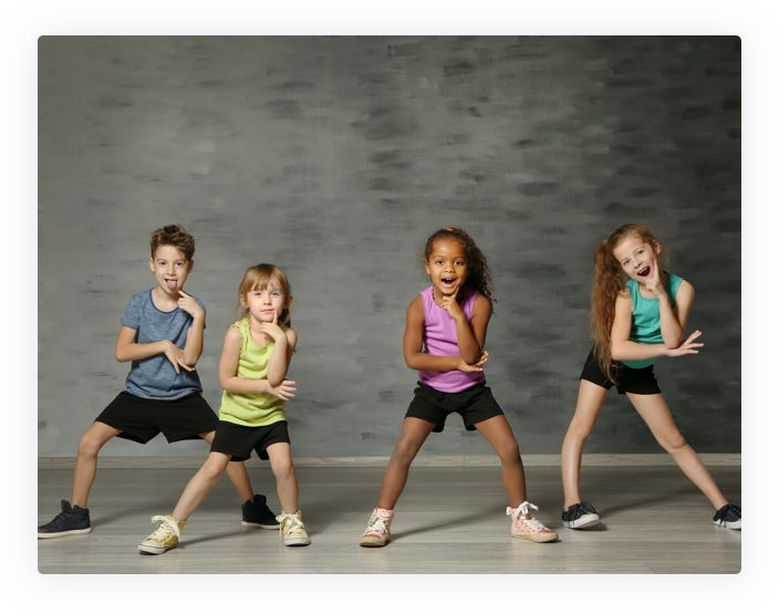 four young children are posing for the camera