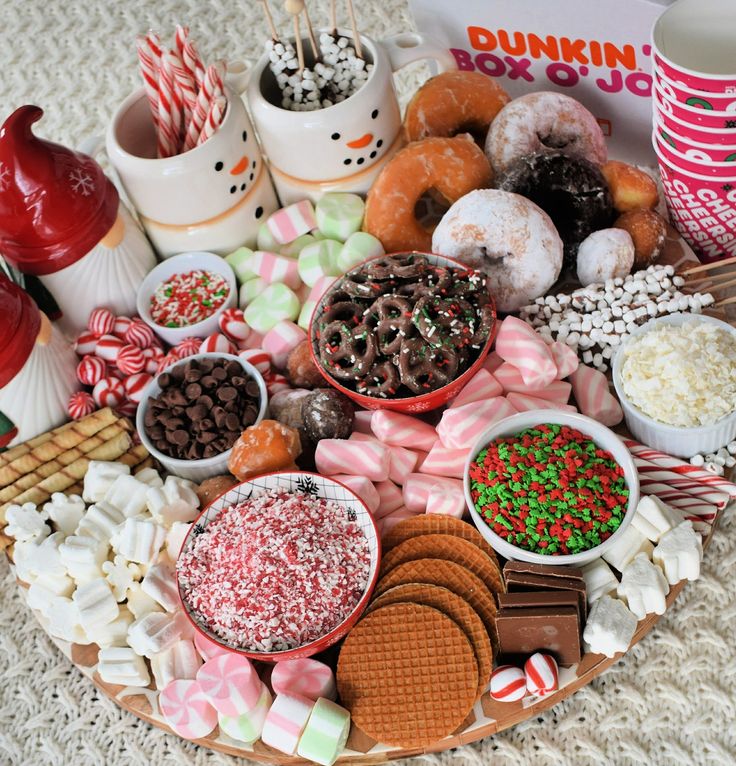 a platter filled with lots of different types of candy and candies on top of a table