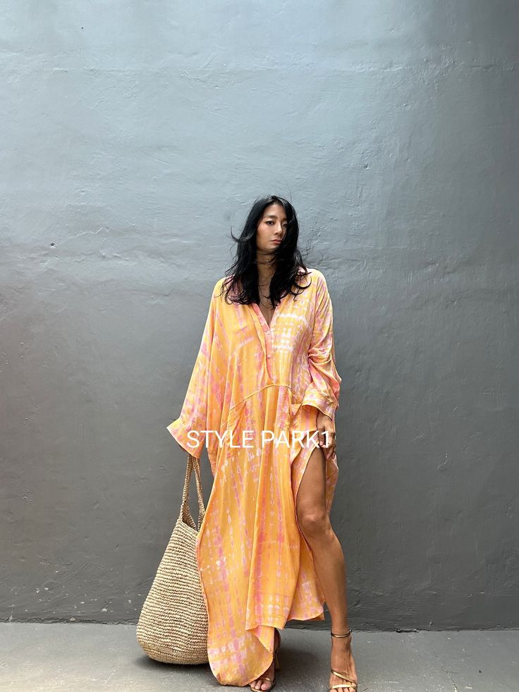 Jimbaran dress  is an oversized long sleeve soft rayon voile Long shirts  dress  .  This Oversized shirt dress is designed to flatter every body type and fit numerous occasions. 👍Included tali - f e a t u r e s - - Relaxed fit - Front pockets Fabric: 100% Soft rayon voile  Style:oversized fit Color:Bali Hand tie dyed peach & multi motif Wash :Hand cool wash  - measurement -  - One size  -  I recommend American size M to XL Chest /164cm/ 64inch(round) Length/135cm/53inch Transparent - it's  tran Long Shirt Dress For Beach In Fall, Long Sleeve Summer Maxi Dress For Brunch, Summer Long Sleeve Maxi Dress For Brunch, Oversized Long Sleeve Maxi Dress For Vacation, Flowy Long Sleeve Beach Dress, Oversized Long Shirt Dress For Vacation, Billowy Long Sleeve Casual Maxi Dress, Oversized Long Sleeve Maxi Dress For Day Out, Oversized Maxi Dress For Summer Daywear