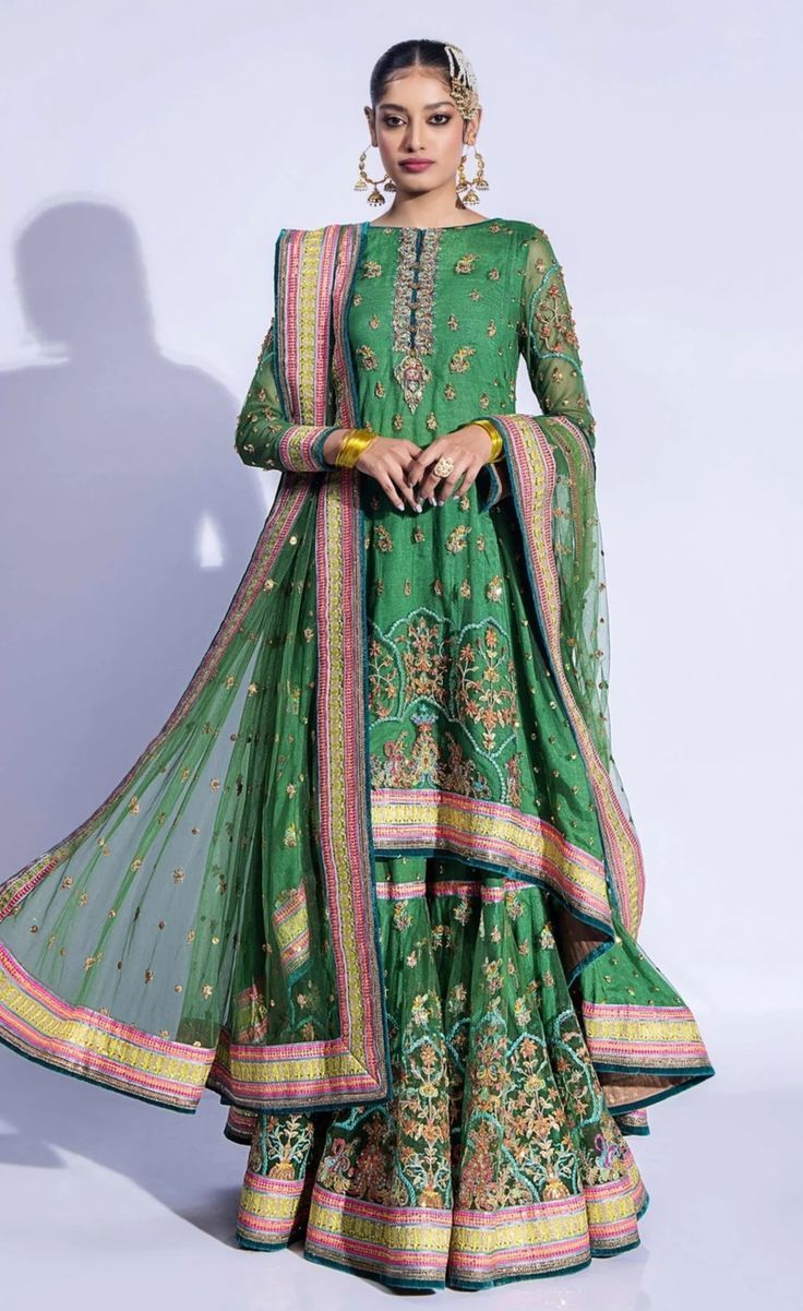 Gharara Kameez Dupatta Green Pakistani Mehndi Dress Anarkali Sharara With Dabka Work, Anarkali Sharara With Dabka Work And Traditional Drape, Eid Anarkali Sharara With Mirror Work, Anarkali Style Sharara With Mirror Work For Transitional Season, Transitional Anarkali Sharara With Mirror Work, Anarkali Dabka Sharara For Navratri, Eid Floor-length Sharara With Mirror Work, Transitional Green Anarkali Sharara, Anarkali Style Sharara With Mirror Work In Chinon