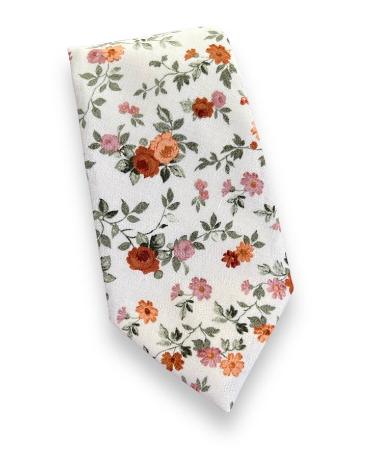 "This brown floral necktie, and bowtie are perfect for any special occasion.  The regular necktie is 3.5 inches wide and 59 inches long.  The skinny necktie is 2.5 inches wide and 59\" long." White Necktie For Gift, White Standard Tie For Gift, White Standard Tie As Gift, White Standard Tie For Black Tie Events, White Ties Neckwear For Spring, White Neckwear With Ties For Spring, Dapper White Suit And Tie Accessories For Summer, Elegant Spring Bow Tie For Gift, Elegant Spring Bow Tie As A Gift