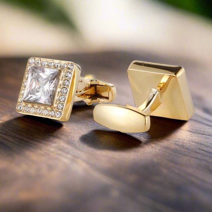 Gold Cufflinks with Clear Glass Stones These gold-colored cufflinks with clear glass stones add a touch of luxury and sophistication to any outfit. Their classic design makes them a versatile accessory for both formal and semi-formal occasions. Dress Shirts: White Dress Shirt: Timeless and elegant, a white dress shirt pairs perfectly with the gold and clear stone cufflinks, highlighting their brilliance. Light Blue Dress Shirt: Adds a hint of color while maintaining a refined look, allowing the Elegant Clip-on Cufflinks For Business, Elegant Formal Clip-on Cufflinks, Classic Cuff Jewelry For Party, Timeless Gold Cufflinks For Business, Elegant Gold Cufflinks, Classic Gold Cufflinks For Party, Classic Gold Formal Cufflinks, Elegant Silver Cufflinks For Office, Gold Clip-on Cufflinks For Business