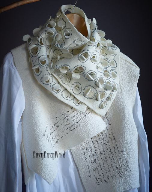 a white scarf with writing on it