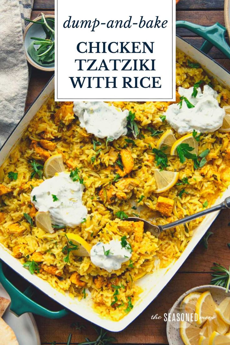 a large casserole dish filled with chicken, rice and sour cream on a wooden table