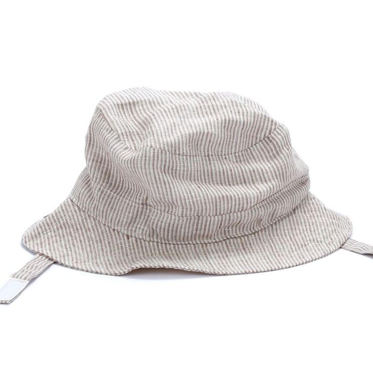 Perfect for those outdoor adventures, our vintage-style linen hat will stay secure and comfy thanks to the velcro chin strap feature. Little explorers will look adorable and stay safe. Size: S (1-2Y) w/ Chin Strap Size: M (2-6Y) w/ Chin Strap 60% Linen 40% Cotton Velcro Closure Hand Wash Only; Hang Dry Adjustable Brimmed Sun Hat For Adventure, Brimmed Sun Hat For Summer Adventure, Wide Brim Sun Hat For Summer Adventure, Summer Adventure Brimmed Sun Hat, Summer Bucket Hat For Adventure, Adjustable Fit Beige Brimmed Sun Hat, Adjustable Fit Beige Hat For Outdoor, Adjustable Bucket Hat For Adventure, Summer Brimmed Adventure Hat