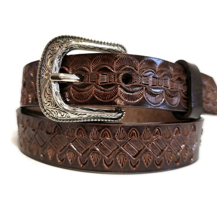 Check out this cool find! A genuine leather belt perfect for kids, crafted to pair seamlessly with all types of jeans. Not just any belt, this one's HANDMADE from top-notch leather and features an awesome hand-tooled design that's sure to stand out. Plus, it's got snaps for quick buckle swaps. Talk about handy!" Width:    1 inch Mod.14 Unsure what belt size is your little one? Please let me know what is his waist measurement. This belt is in stock and ready to be shipped! No shipping to PO Boxes Artisan Leather Belts For Gifts, Artisan Leather Belt For Gift, Adjustable Embroidered Brown Belt, Adjustable Brown Embroidered Belt, Hand Tooled Leather Belt Gift, Adjustable Hand-tooled Leather Belt, Rustic Hand Tooled Adjustable Belts, Brown Hand Tooled Adjustable Belts And Suspenders, Adjustable Hand Tooled Brown Belt