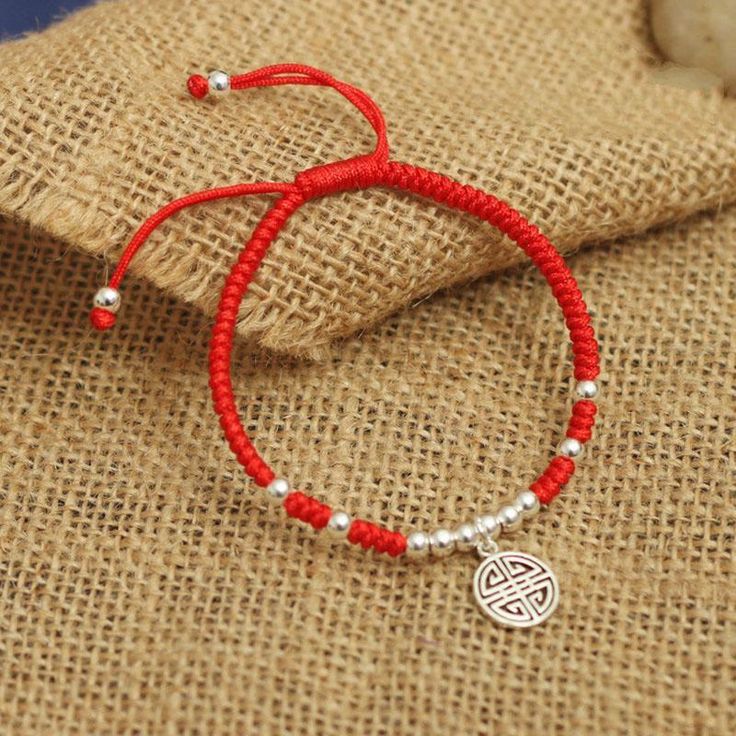 This 925 Sterling Silver 'Lu' Symbol combined with the Lucky Red Rope bracelet is all about enhancing PROSPERITY. The Chinese Symbol Lu is a symbol of Prosperity, Rank, and Influence. In Feng Shui, Lu ( wealth) , together with Fu (luck) and Shou (Longevity), comprise the three celestial stars in heaven. Setting the symbol in a circle supposedly increases its effectiveness because the circle represents a coin and a coin = wealth. It has long been believed that the simple Red Rope bracelet has pro Prosperity Bracelet, Celestial Stars, Red Rope, Handmade Bangles, Red Bracelets, Macrame Bracelet, String Bracelet, Silver Pendants, Bangles Jewelry