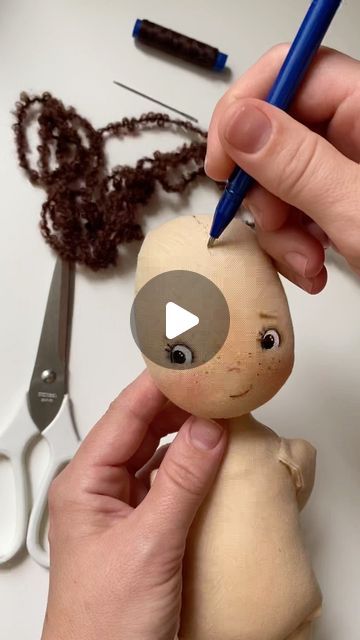 someone is making a stuffed animal out of clay