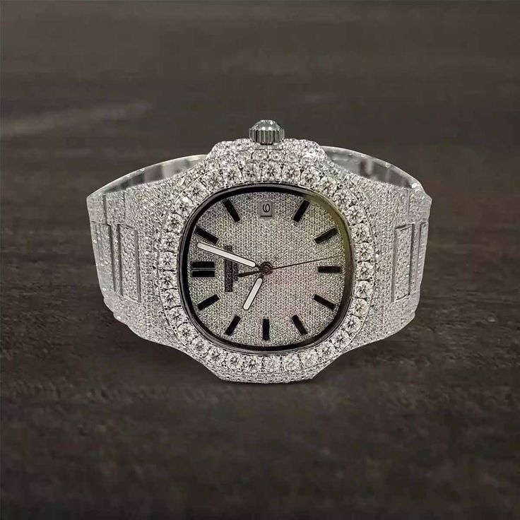 Iced Out Patek Philippe Watch From Patek Philippe Nautilus Collection - A Genuine Luxury Timepiece Meticulously Embellished with Premium Quality Sparkling Round Cut White Moissanite Diamonds in Stainless Steel Metal, Features Automatic Swiss Movement Analogue with Date Indicator, 40 mm Rounded Octagonal Moissanite Diamond Studded Dial and 14k White Gold Rhodium Plated Bracelet Strap. Skull Engagement Ring, Ring Enhancer, Vintage Inspired Rings, Moss Agate Ring, Mother Rings, Luxury Timepieces, Patek Philippe Nautilus, Bridal Bands, Band Engagement Ring