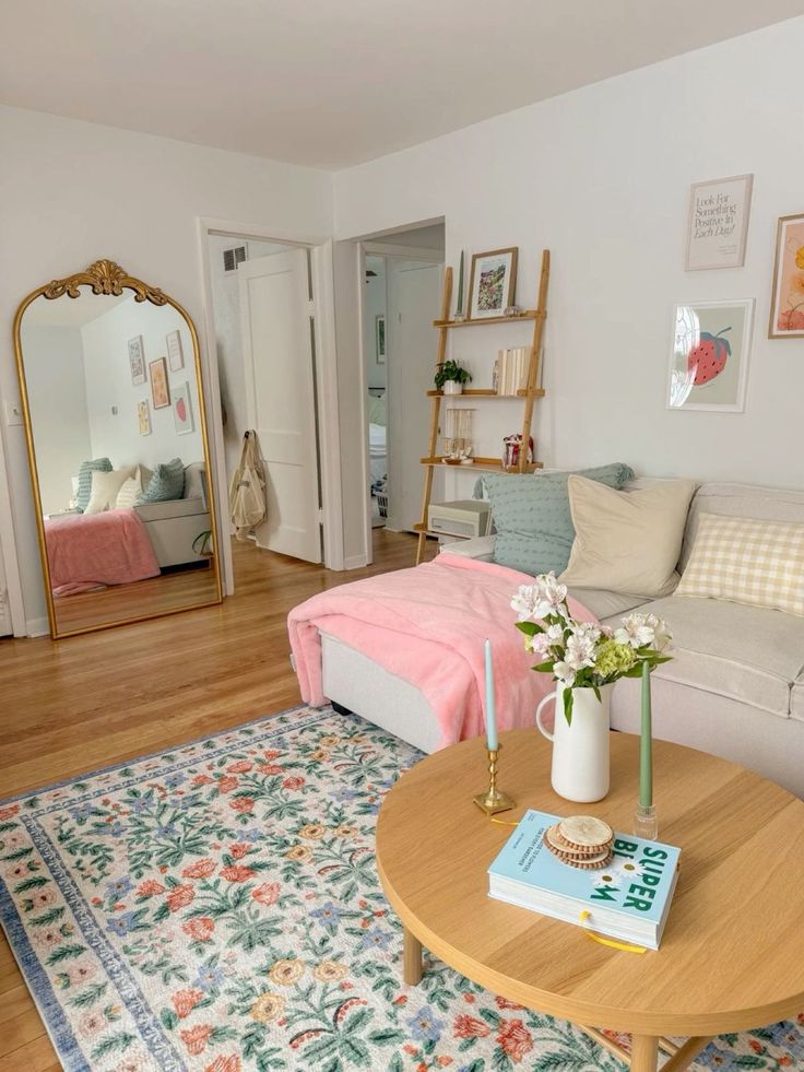 a living room filled with furniture and a mirror