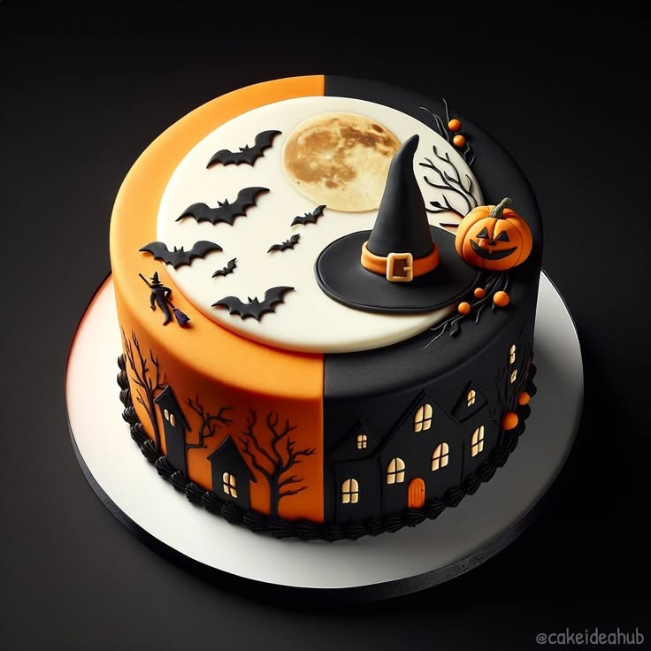 a halloween themed cake with pumpkins and bats