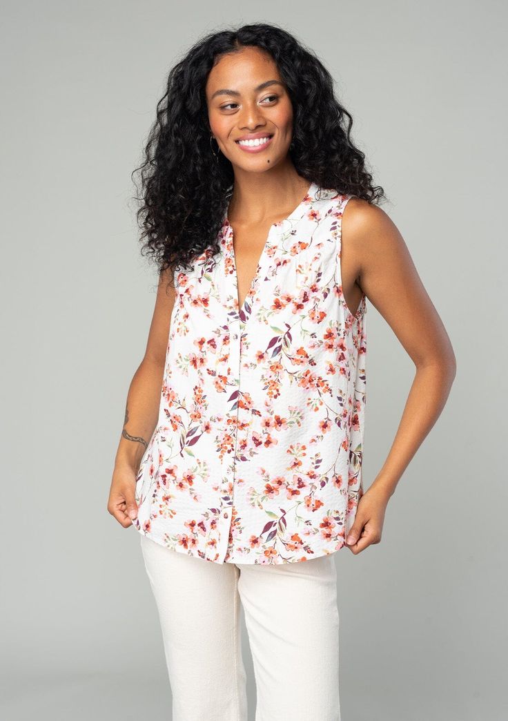 A classic sleeveless spring blouse in a natural and rose pink floral print. Floral print Relaxed fit Sleeveless Hip length Split neckline Banded collar Self-covered button front Classic spring blouse Polished enough for the office but laid-back enough for the weekend, our classic spring blouse is designed in an ultra-pretty floral print. With a split v-neckline and a delicate self-covered button front. Model is 5'8, wearing a size S.Style: I-15020W-SDT-FV Chic Floral Print Top With Split Neck, Versatile Sleeveless Spring Blouse, Feminine Floral Print Top With Split Neck, Versatile V-neck Blouse With Floral Print, Pink Floral Print Blouse With Split Neck, Pink Floral Print Split Neck Blouse, Feminine Summer Tops With Split Neck, Spring Workwear Sleeveless Blouse, Pink Split Neck Blouse With Floral Print