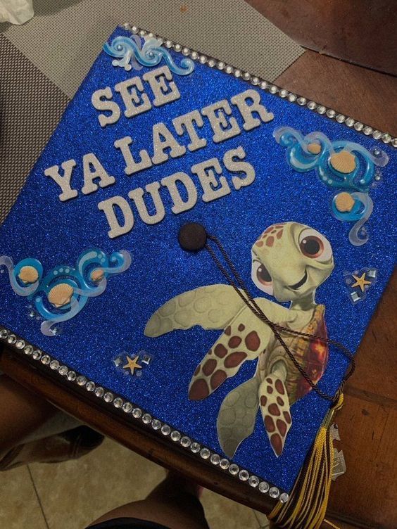 a blue graduation cap that says see ya later dudes with a sea turtle on it