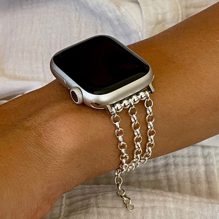 Hypoallergenic Silver Bracelet For Apple Watch 38mm 40mm 41mm 42mm 44mm 45mm With Silver Stainless Steel Attachments/Connectors Includes Sterling Silver Beads & Lobster Claw Clasp High Quality Adjustable Size Smartwatch Jewelry Formal Feminine Style Replacement Accessory Designed & Handmade By Simeon D Jewelry Studio Please Measure Your Wrist As Pictured & Select Size Please Watch The Video How To Easily Put The Bracelet On Elegant Stylish Gift For Any Holiday Or Occasion Not For Other Models. A Silver Timeless Bracelet Strap Watch Bands, Timeless Silver Watch Band With Bracelet Strap, Timeless Silver Bracelet Strap Watch Band, Modern Silver Jubilee Bracelet Watch Band, Metal Chain Watch Bands As Gift, Metal Watch Chain Accessories As Gift, Metal Watch Chain As Gift, Metal Chain Watch Accessories As Gift, Silver Bracelet Strap Apple Watch Band For Everyday