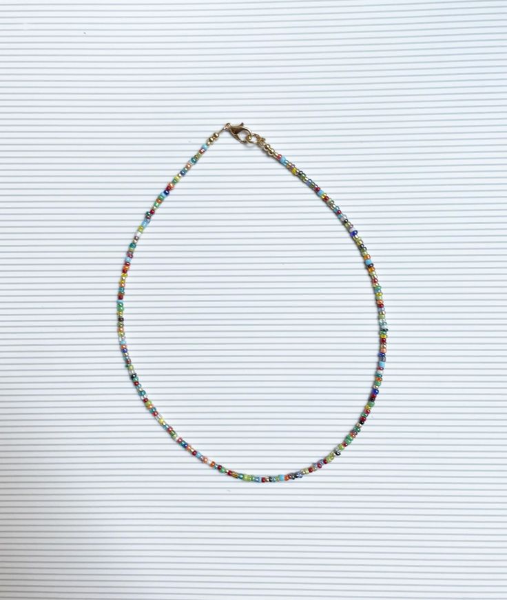 Colorful seed bead handmade necklace  Handmade with love and care one at the time in our studio in sunny California  Materials: Glass Beads, nickel free  For custom length please feel free to message us  Fun and flirty. Perfect for summer, concerts, first date, add cuteness to your everyday casual looks. Gift for mom, sister, a friend or yourself💕 Unisex Rainbow Round Beaded Necklaces With Tiny Beads, Everyday Heishi Beaded Necklaces, Heishi Beaded Necklaces With Heart Beads, Heishi Beads Necklace With Heart Beads As Gift, Handmade Everyday Beaded Necklaces With Round Beads, Diy Choker, Summer Concerts, Seed Bead Choker, Colored Necklace