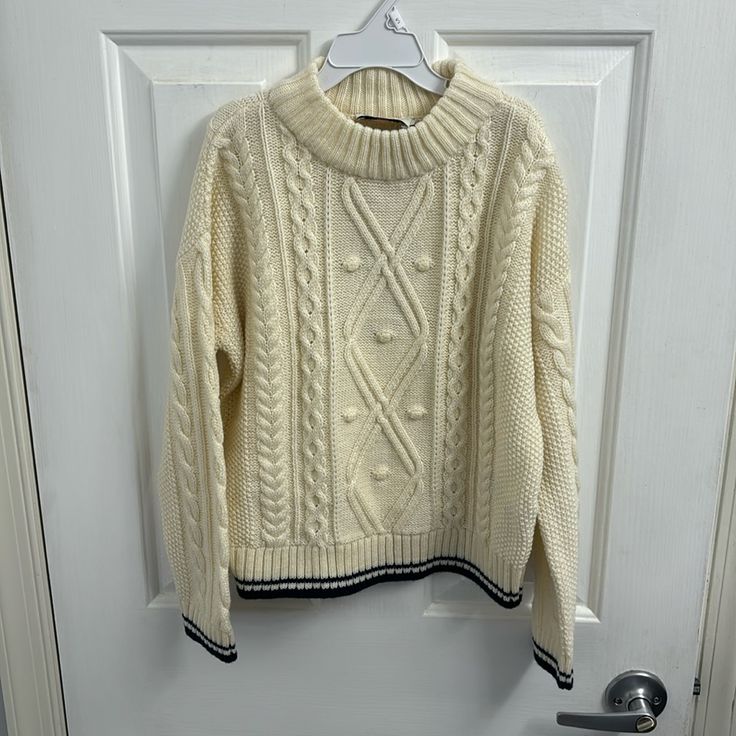 Girls Cream Color Knit Sweater By Vineyard Vines Size Medium. Navy Blue Outlining On The Bottom Of The Sweater. Nwt Casual Cream Sweater With Ribbed Collar, Cute Cream Soft Knit Sweater, Cute Cream Knit Tops, Cozy White Sweater With Ribbed Collar, Cute Cream Crew Neck Sweater, Cute Cream Knit Sweater, Cute Winter Cable Knit Tops, Cute Cable Knit Winter Tops, Cute Cream Knitted Sweater