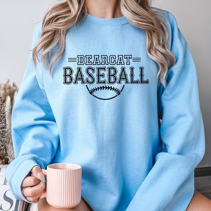 Gear up for success on and off the field with our Custom Baseball Team Sweatshirts, designed to unite your squad in style. Whether you're prepping for game day or celebrating a hard-fought victory, these sweatshirts are the ultimate symbol of team pride. Crafted from premium, ultra-soft fabric, our sweatshirts offer unbeatable comfort and durability, ensuring you stay warm and cozy during those chilly practices and post-game celebrations. But what truly sets them apart is their customizable design – you have the freedom to add your team's logo, name, or any other personalized details that represent your squad's identity. From Little League dreamers to seasoned veterans, our Custom Baseball Team Sweatshirts are perfect for players of all ages and skill levels. Whether you're huddling up in Collegiate Sweatshirt For Football Season, Collegiate Sweatshirt For College Football Season, Game Day Pre-shrunk Athletic Heather Tops, Collegiate Pre-shrunk Sweatshirt For College, Collegiate Athletic Heather Tops For Game Day, Game Day Tops In Athletic Heather, Collegiate Style Tops In Athletic Heather For Game Day, Collegiate Sweatshirt With Team Logo For Football Season, College Football Season Fan Apparel Sweatshirt