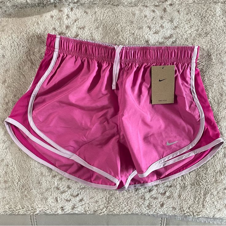 New With Tags. Nike Women’s Tempo Running Shorts. Elastic Waistband With Drawstring. Inner Lining. Pink With Lavender Piping. Size M Nike Pink Athletic Shorts For Summer, Nike Beach Shorts With Stretch, Nike Pink Shorts For Summer, Pink Nike Shorts For Summer, Nike Beach Shorts, Nike Athletic Shorts With Elastic Waistband For Beach, Pink Nike Shorts With Elastic Waistband, Nike Pink Shorts With Elastic Waistband, Summer Purple Athletic Shorts With Elastic Waistband