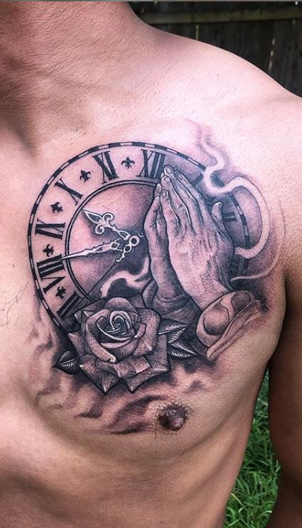 a man with a tattoo on his chest holding hands in front of a clock and roses