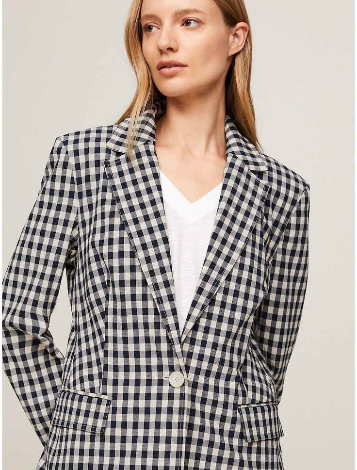 Tommy Hilfiger women's blazer. Formal styling takes a playful turn with this single-breasted blazer, cut to a slim fit from lightweight breathable seersucker.  Material: 50% Sustainable Modal (smd), 46% Cotton, 4% Elastane. Classic Gingham Blazer For Work, Spring Gingham Blazer For Workwear, Tommy Hilfiger Spring Workwear Blazer, Tommy Hilfiger Spring Blazer For Work, Casual Tommy Hilfiger Blazer For Work, Tommy Hilfiger Casual Blazer For Work, Tommy Hilfiger Tailored Single Breasted Blazer, Tommy Hilfiger Notch Lapel Blazer For Business Casual, Tommy Hilfiger Tailored Workwear Blazer