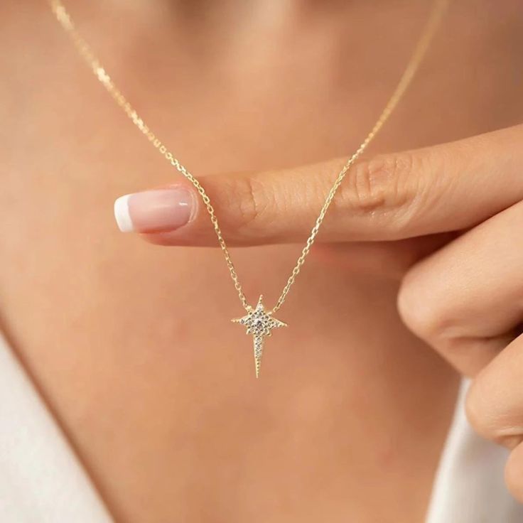 Let’s add enthralling beauty to your everyday get-up by wearing this awe-inspiring Northern Star Polaris Necklace. Fashioned in a 925 recycled sterling silver, it elegantly highlights a celestial-inspired northern star decorated with meticulously-cut gleaming cubic zirconias, adding a sparkle to your day-to-night style. It has an 18-inch adjustable linking chain- so adjust it to the desired length to accent your T-shirt, collar shirt, crop top, fancy top, and much more. This mesmerizing necklace Fine Jewelry Sterling Silver Star Necklace, Silver Star Necklace For Formal Occasions, Delicate Sterling Silver Star Necklace, Sterling Silver Star Necklace With Sparkling Details, Star-shaped Sparkling Cubic Zirconia Necklaces, Unique Sterling Silver Jewelry, Star And Moon Necklace, Sterling Silver Chain Necklace, Star Jewelry