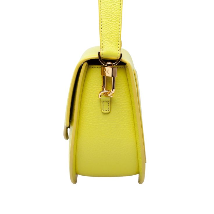 The Ella Wave Saddle Bag – This is the perfect day to evening bag with its 2 detachable straps a short leather shoulder strap and a mini crossbody chain strap. This bag embodies durability and timeless design, making it an essential addition to your wardrobe.  *The yellow-green Chartreuse bag comes in a small grained pebble leather.   Light gold-toned custom hardware Microsuede Lining Cow Leather Exterior Interior: 1 open pocket Comes with 2 Shoulder Straps: Leather Shoulder Strap 20. 5" attache Formal Yellow Shoulder Bag With Adjustable Strap, Yellow Shoulder Flap Bag With Detachable Strap, Yellow Crossbody Flap Bag With Detachable Strap, Formal Crossbody Baguette Bag With Detachable Strap, Yellow Satchel Flap Bag With Detachable Strap, Evening Flap Bag With Detachable Strap And Round Handle, Luxury Baguette Satchel Bag With Adjustable Handle, Formal Yellow Satchel With Detachable Strap, Evening Rectangular Saddle Bag With Detachable Strap