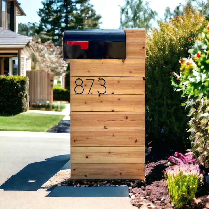 a wooden mailbox with the number 783 on it