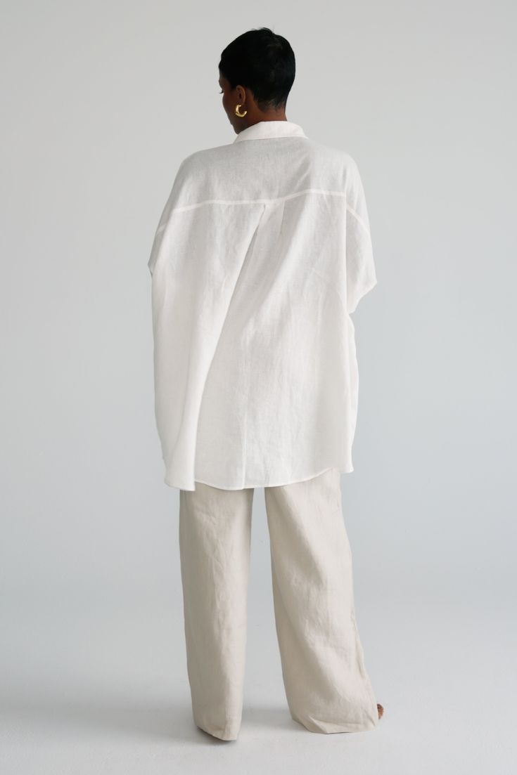 Crafted with 100% linen, this Oversized Shirt is the perfect piece to add to your collection of wardrobe staples. Made from a lightweight fabric, this piece ensures maximum comfort that is accentuated by the oversized fit. A perfect staple for your staycation or European summer vacation. Chic Linen Shirt With Shirttail Hem, Spring Relaxed Fit Ramie Shirt, White Linen Blouse With Shirttail Hem, Spring Relax Fit Ramie Shirt, Relaxed Fit Linen Blouse With Shirttail Hem, Everyday Linen Blouse With Shirttail Hem, White Linen Shirt For Daywear, Effortless Linen Top With Shirttail Hem, Oversized Versatile Blouse For Beach